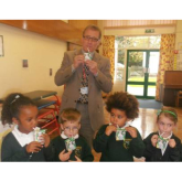 Mark Pawsey MP hands out the milk cartons at Bawnmore School