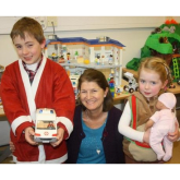 Seven-year-old santa delivers presents for disabled children at Tadworth charity @childrens_trust