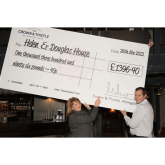 Crown & Thistle present cheque to Helen & Douglas House