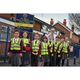OPTICIAN HELPS SCHOOL CHILDREN SEE AND BE SEEN