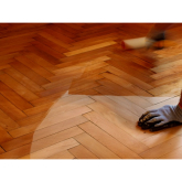 What is the best way to clean a hardwood or parquet floor?