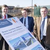 Councillor Adrian Andrew inspects plans for new railway station