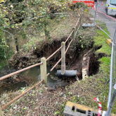 Work to Repair Collapsed River Embankment Underway