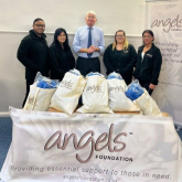 Andrew Mitchell MP helps Angels Foundation hand out essential parcels for people in need at the Baptist Church
