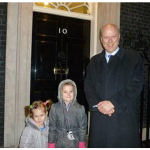 The 6 year old winner of Epsom Christmas Card competition has photo taken at No 10