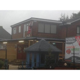 Santa is back in Ashtead – up a ladder?