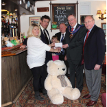 Swan Inn donate £410 to TLC Teddy Appeal