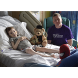 Housing Units surprises Ward 84 with Norman the Doorman teddy bear delivery