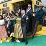 The cast of To The Streets drive into performances at Handsworth Park