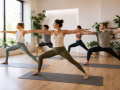 Yoga class in Eastbourne with students practising yoga in a calm and welcoming studio environment