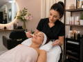 Beauty salon client receiving a professional beauty treatment in a relaxing salon environment