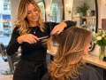 Professional hairdresser providing hair styling services in a modern salon representing Hairdressers in Eastbourne