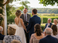 Professional Wedding Celebrants in Eastbourne leading a personalised outdoor wedding ceremony for a couple.
