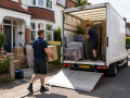 Professional Man and Van Hire in Eastbourne with movers carefully loading furniture into a removal van.