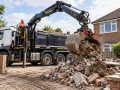 Grab lorry collecting rubble for grab hire in Eastbourne